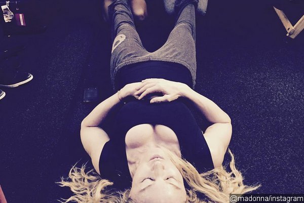 Madonna Receives Backlash Over Photo of Adopted Black Kids Rubbing Her Feet