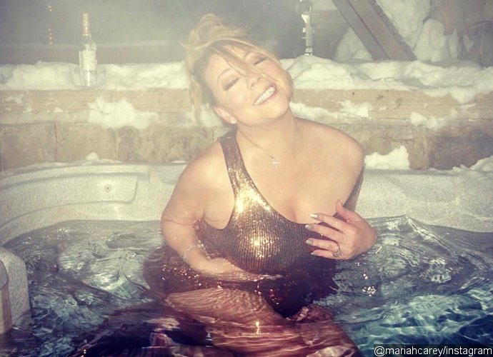 Mariah Carey Strips Down to Golden Swimsuit in Aspen After That Disastrous NYE Show