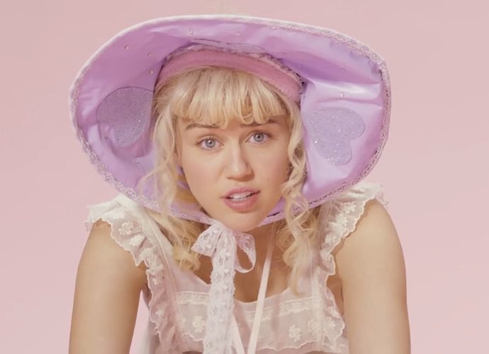 Watch Miley Cyrus as a Foul-Mouthed Big Baby in Bizarre 'BB Talk' Music Video