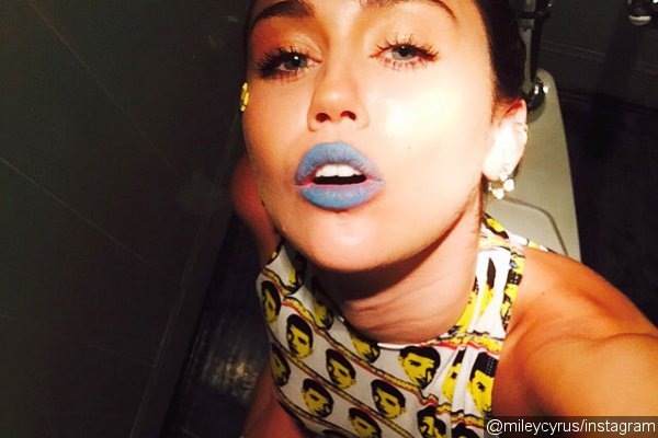 Miley Cyrus Takes Bizzare Toilet Selfie in Drake Outfit