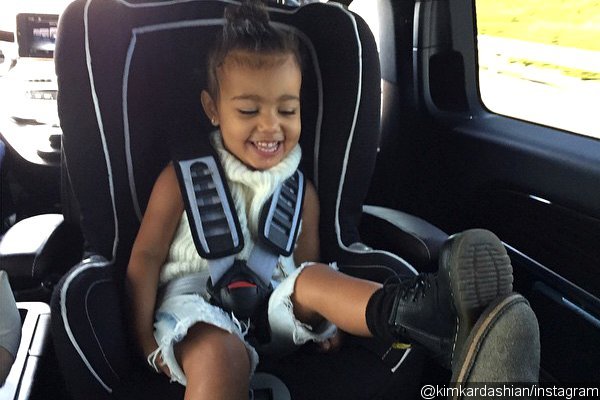 North West Plays Footsie With Dad Kanye West in Adorable Picture