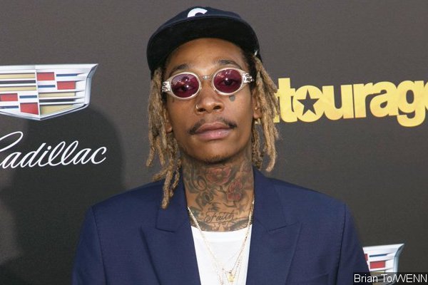 Wiz Khalifa Rides Hoverboard Again at LAX After Arrest
