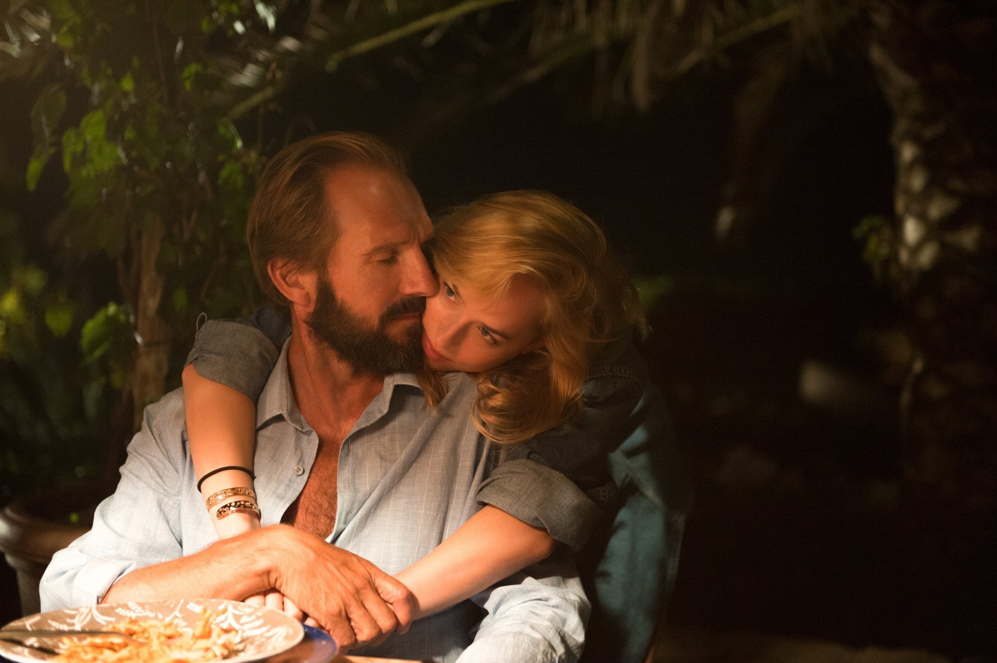 Ralph Fiennes stars as Harry and Dakota Johnson stars as Penelope in Fox Searchlight Pictures' A Bigger Splash (2016)