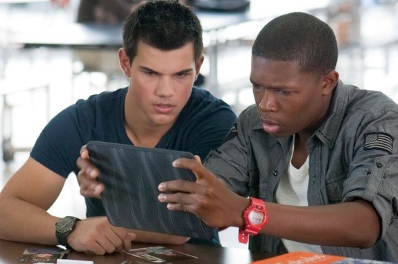 Taylor Lautner stars as Nathan and Denzel Whitaker stars as Gilly in Lionsgate Films' Abduction (2011)