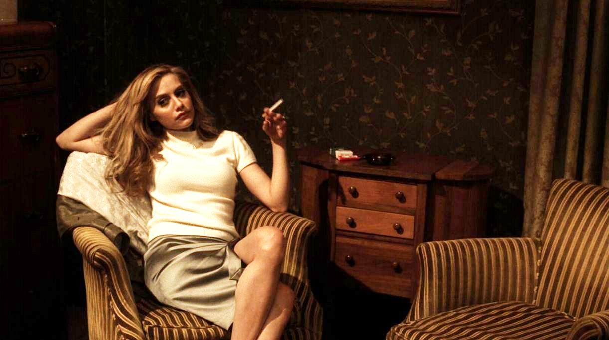 Brittany Murphy stars as June in Image Entertainment's Across the Hall (2010)