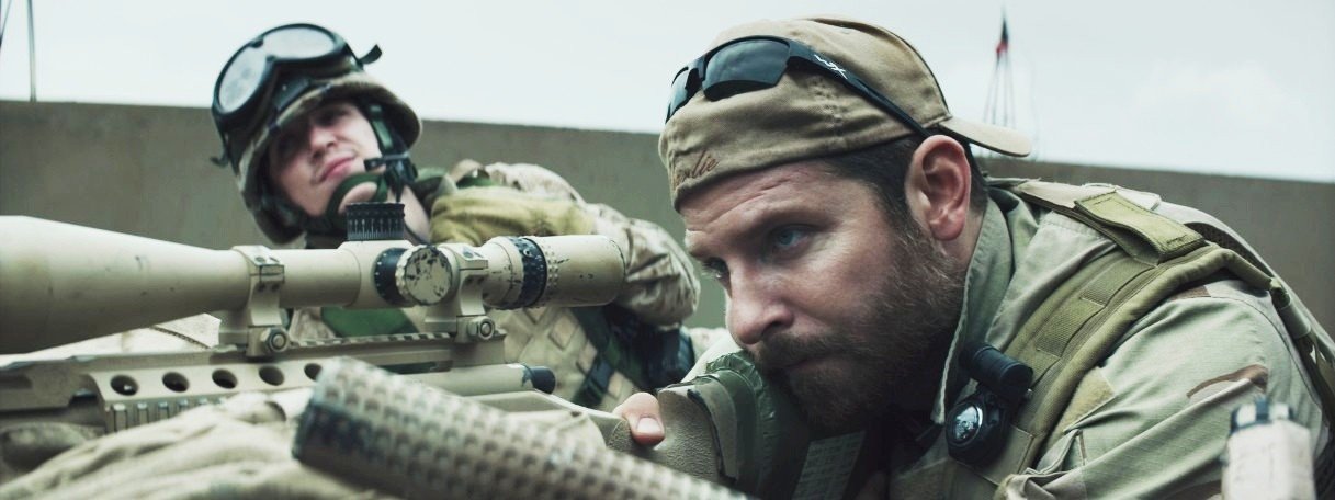 Kyle Gallner stars as Winston and Bradley Cooper stars as Chris Kyle in Warner Bros. Pictures' American Sniper (2014)