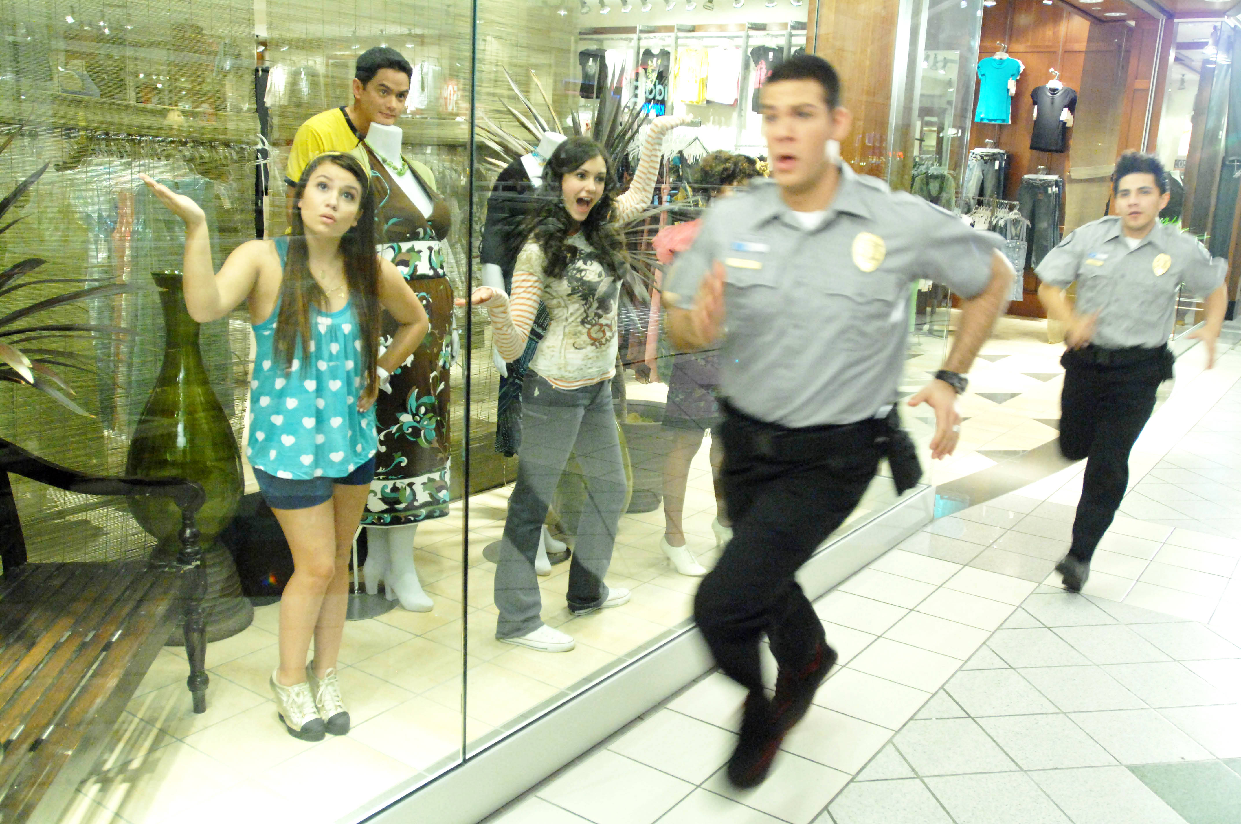 Ally (Nina Dobrev) and friends hide from security in The American Mall (2008)