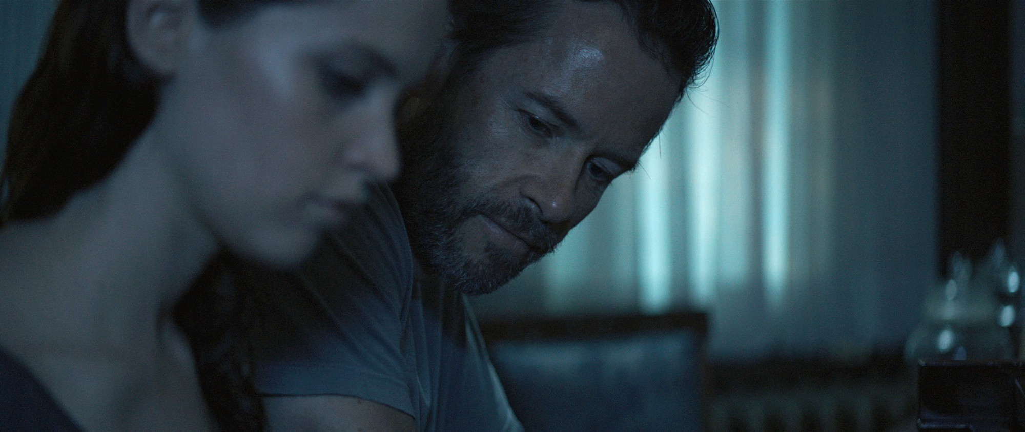 Felicity Jones stars as Sophie and Guy Pearce stars as Keith in Cohen Media Group's Breathe In (2014)