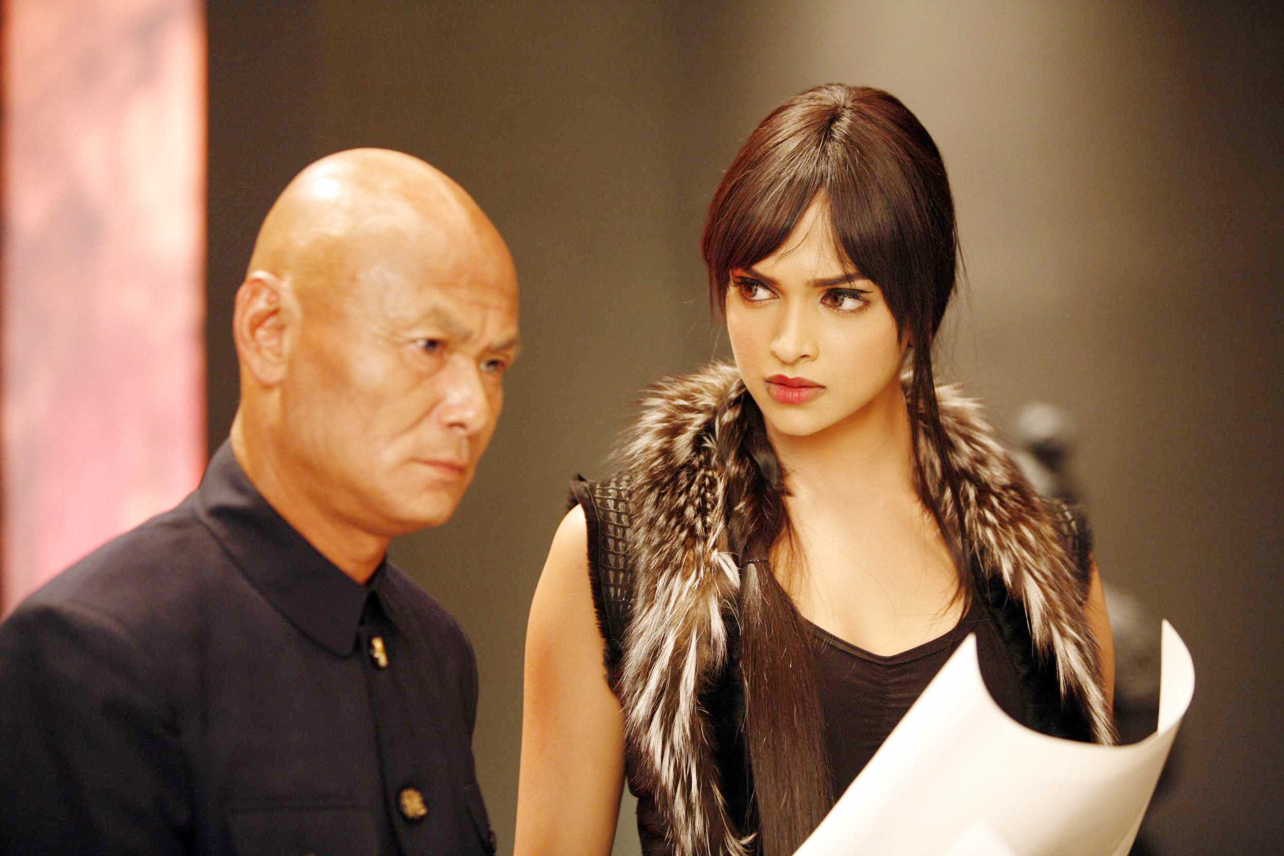Gordon Liu stars as Hojo and Deepika Padukone stars as Meow Meow in Warner Bros. Pictures' Chandni Chowk to China (2009). Photo credit by Sheena Sippy.