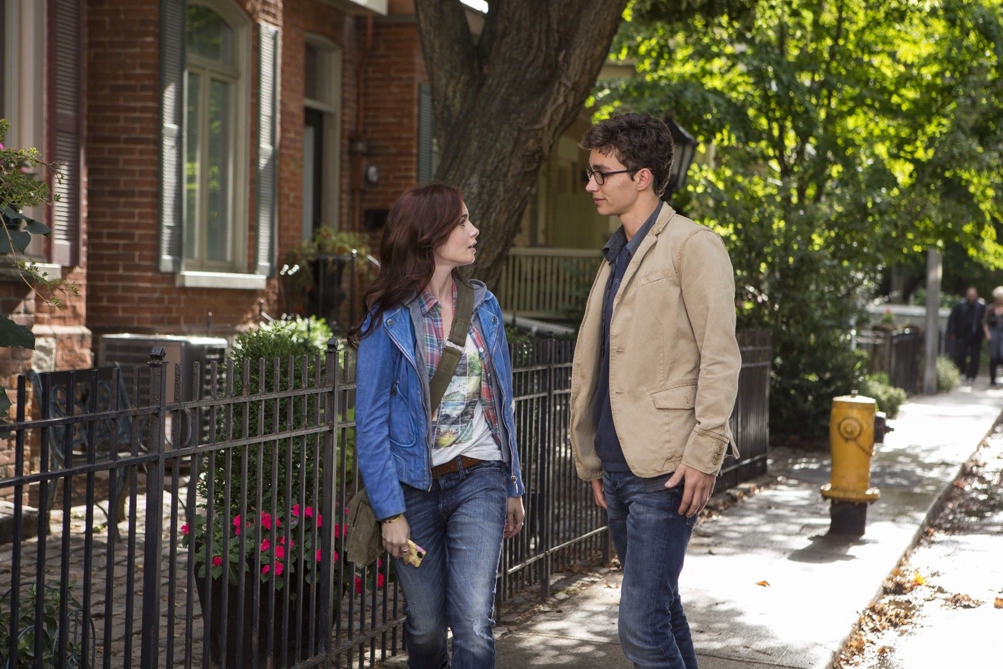 Lily Collins stars as Clary Fray and Robert Sheehan stars as Simon Lewis in Screen Gems' The Mortal Instruments: City of Bones (2013). Photo credit by Rafy.