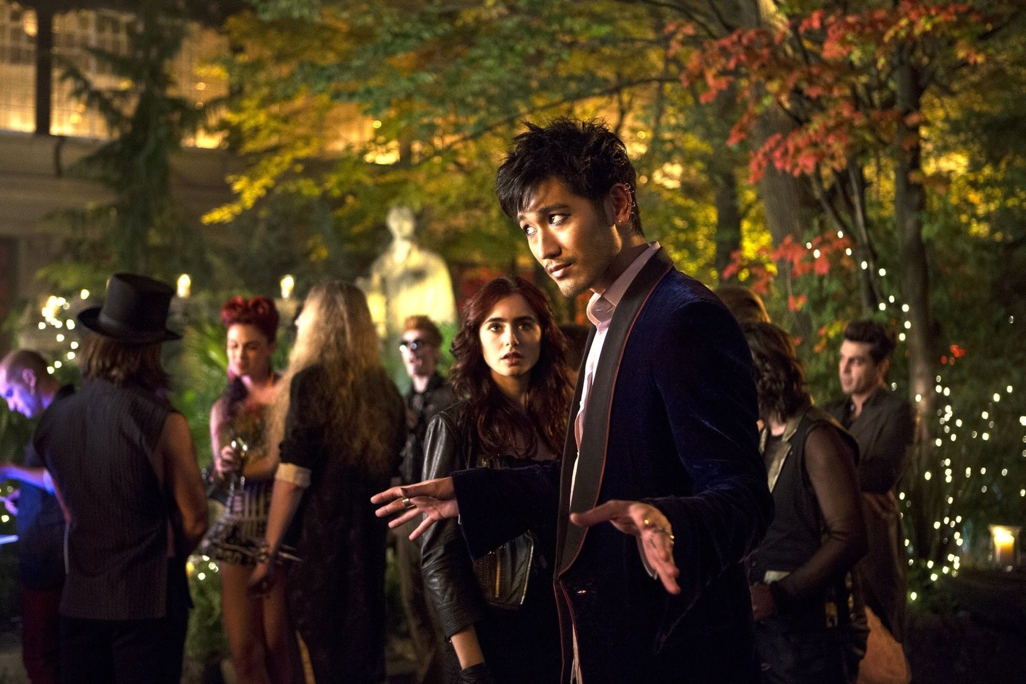 Lily Collins stars as Clary Fray and Godfrey Gao stars as Magnus Bane in Screen Gems' The Mortal Instruments: City of Bones (2013). Photo credit by Rafy.