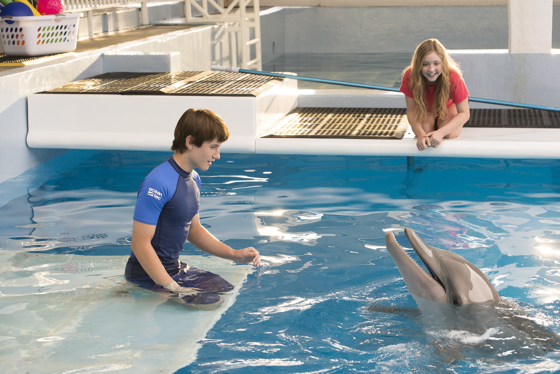 Nathan Gamble stars as Sawyer Nelson and Cozi Zuehlsdorff stars as Hazel Haskett in Warner Bros. Pictures' Dolphin Tale 2 (2014)