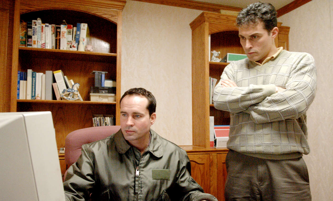 Jason Patric stars as Louis and Rufus Sewell stars as Albert in Strand Releasing's Downloading Nancy (2009)