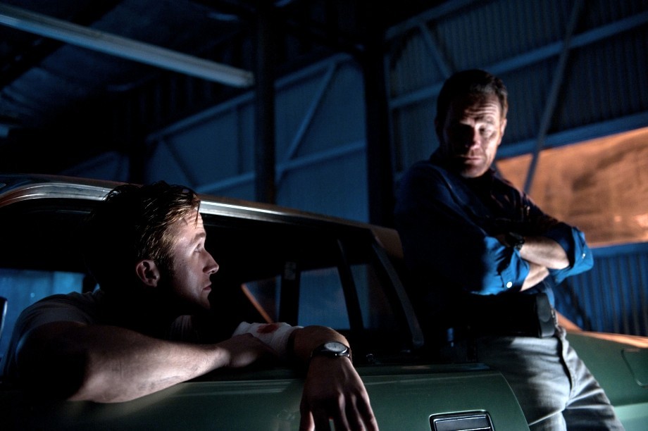 Ryan Gosling stars as Driver and Bryan Cranston stars as Shannon in FilmDistrict's Drive (2011)