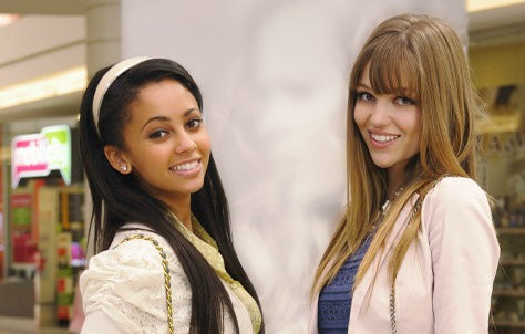 Vanessa Morgan stars as Hannah and Lili Simmons stars as Lola in Disney 