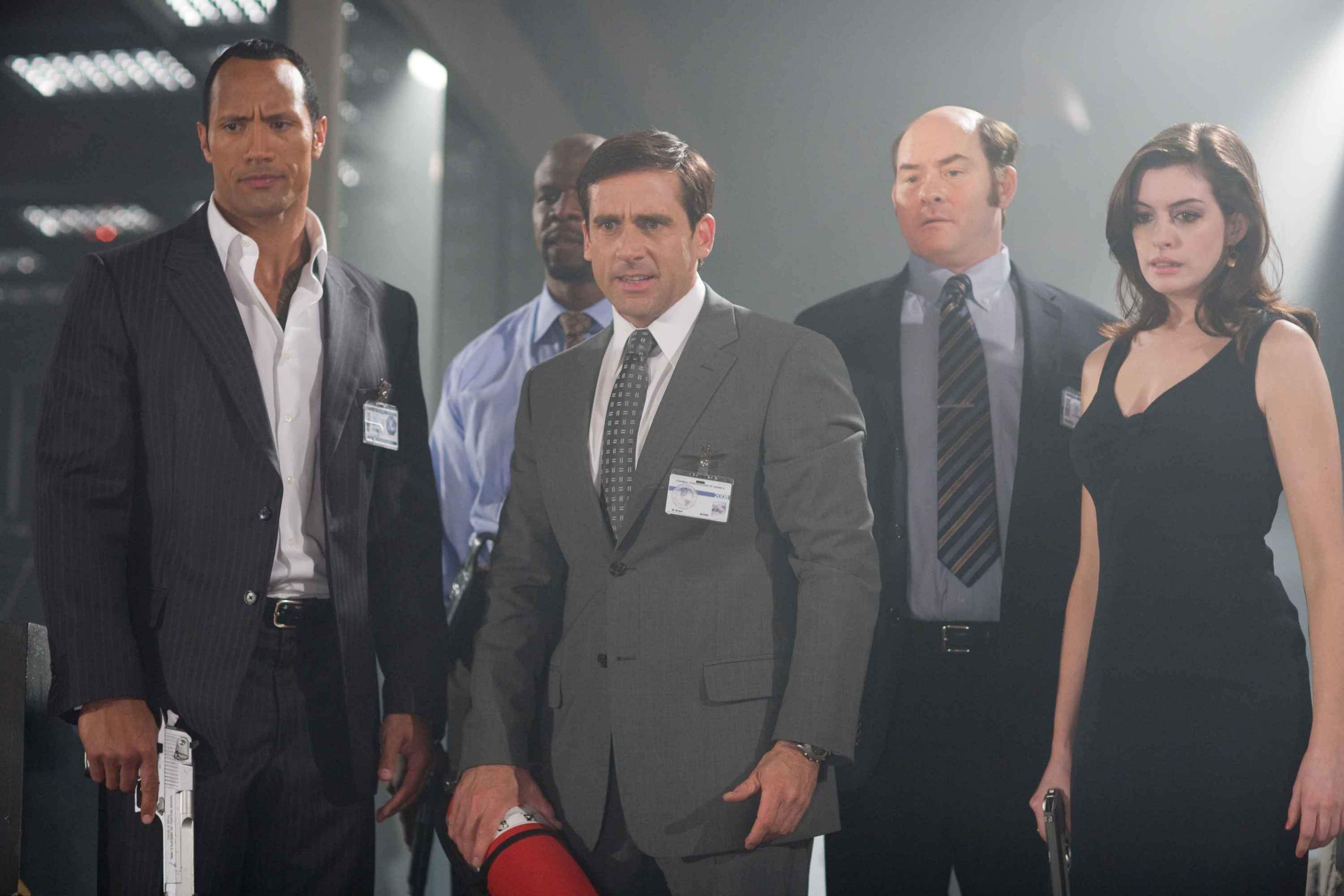 (L-R) The Rock, Steve Carell, David Koechner and Anne Hathaway in Warner Bros Pictures' Get Smart (2008). Photo by Tracy Bennett.