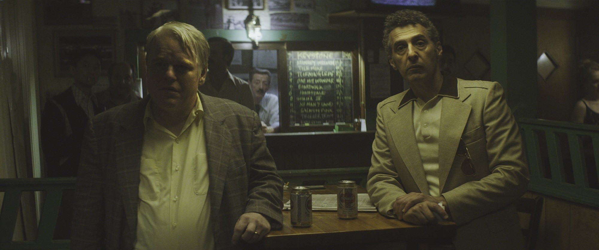 Philip Seymour Hoffman (Mickey Scarpato) and John Turturro in IFC Films' God's Pocket (2014)