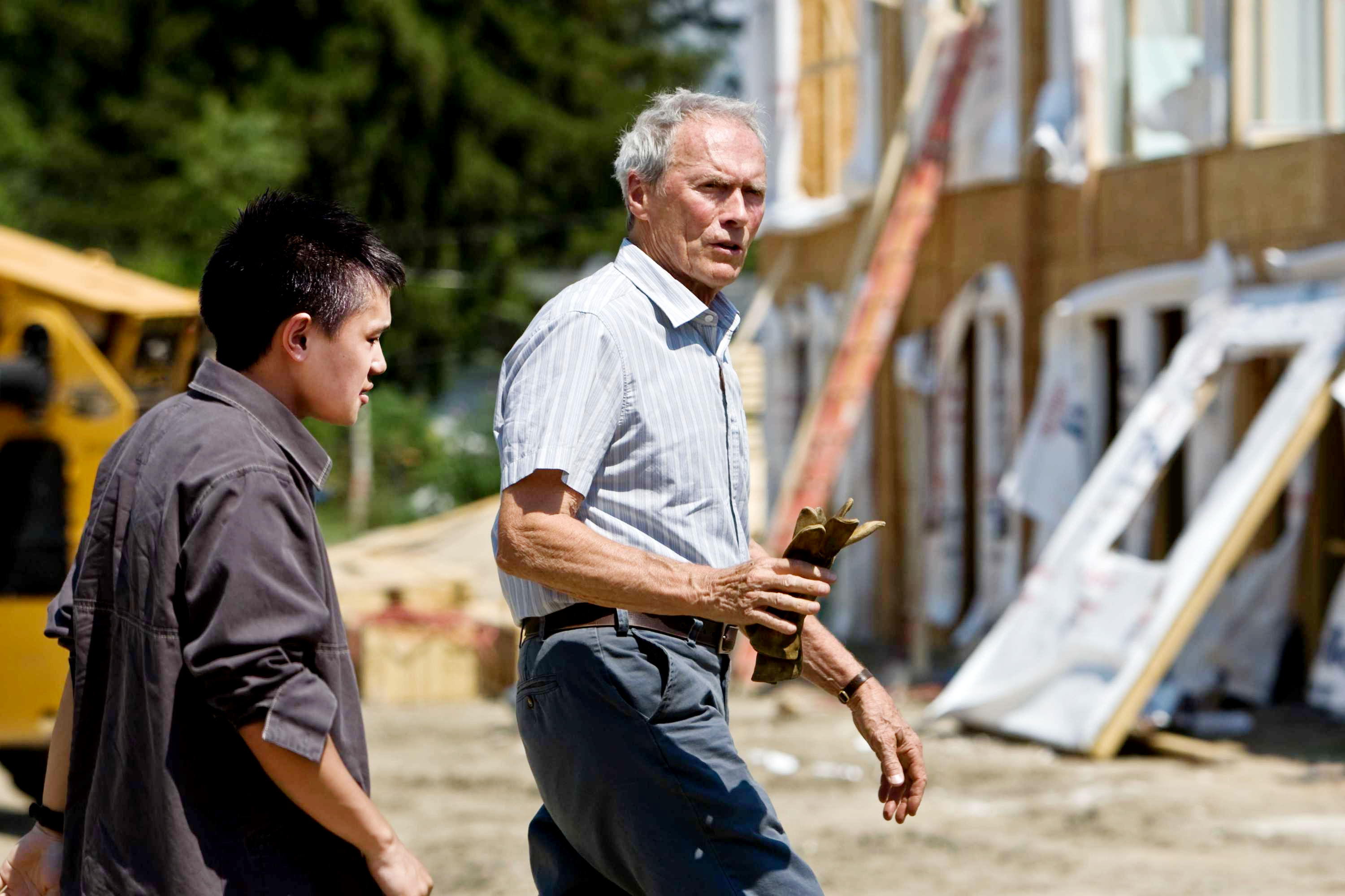 Bee Vang stars as Tao Vang Lor and Clint Eastwood stars as Walt Kowalski in Warner Bros. Pictures' Gran Torino (2008). Photo credit by Anthony Michael Rivetti.
