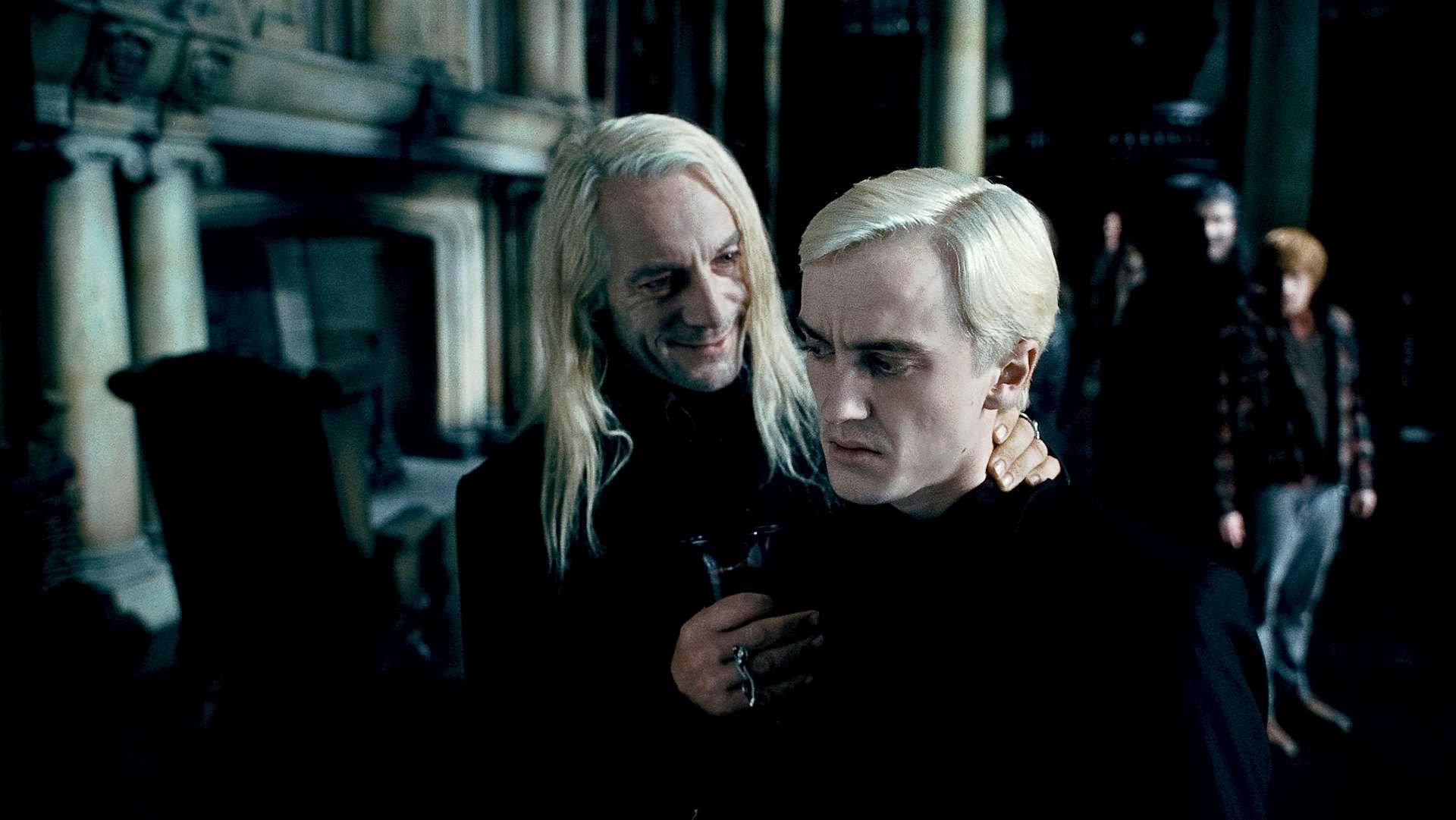 Tom Felton stars as Draco Malfoy and Jason Isaacs stars as Lucius Malfoy in Warner Bros. Pictures' Harry Potter and the Deathly Hallows: Part I (2010)