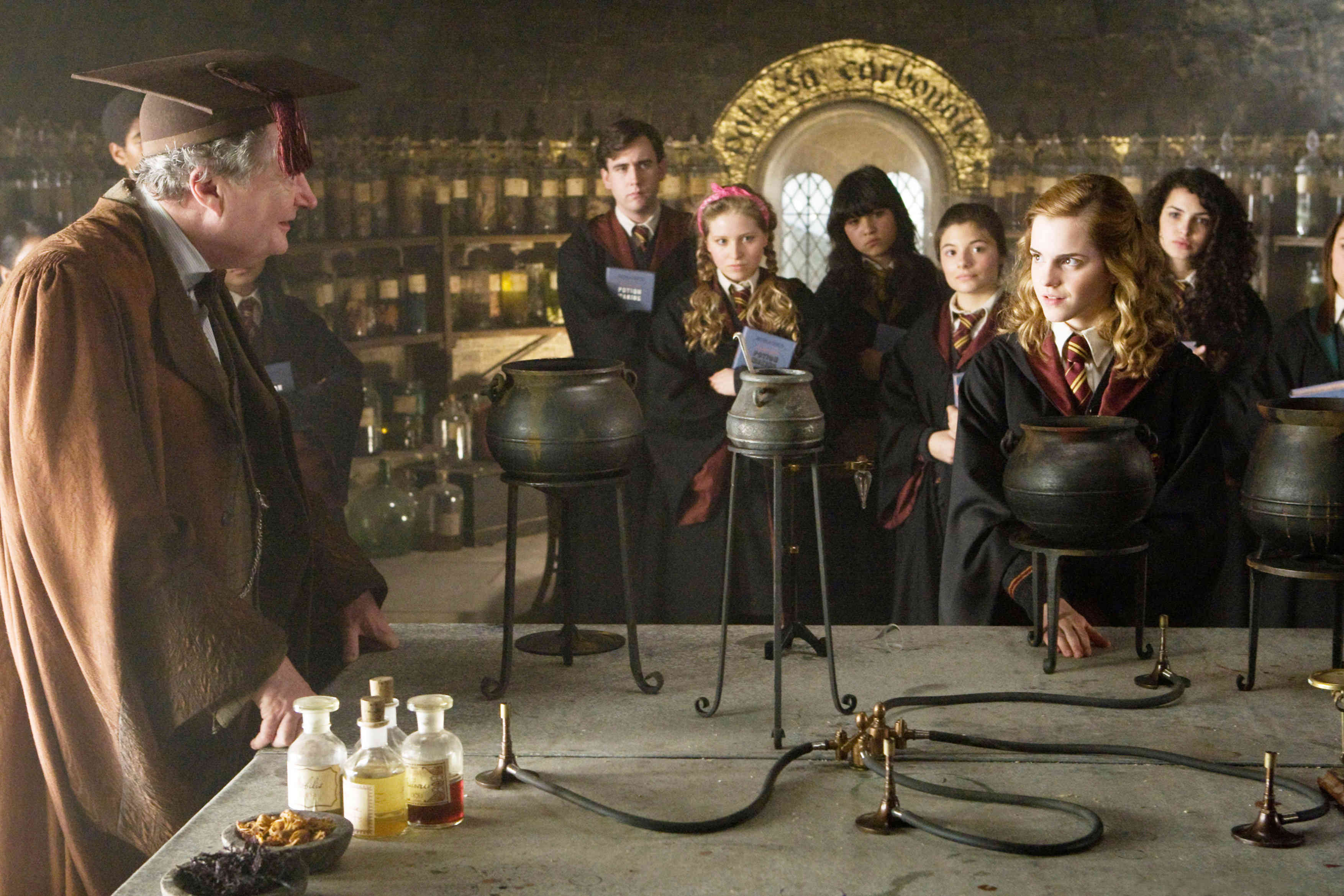 Jim Broadbent stars as Horace Slughorn and Emma Watson stars as Hermione Granger in Warner Bros Pictures' Harry Potter and the Half-Blood Prince (2009)