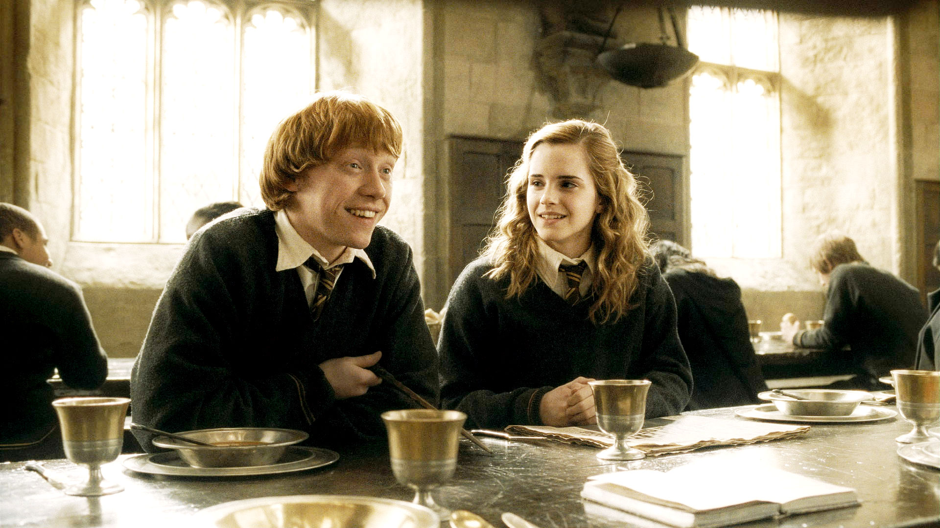 Rupert Grint stars as Ron Weasley and Emma Watson stars as Hermione Granger in Warner Bros Pictures' Harry Potter and the Half-Blood Prince (2009)