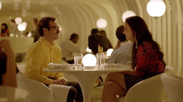 Joaquin Phoenix stars as Theodore and Olivia Wilde stars as Theodore's Blind Date in Warner Bros. Pictures' Her (2013)