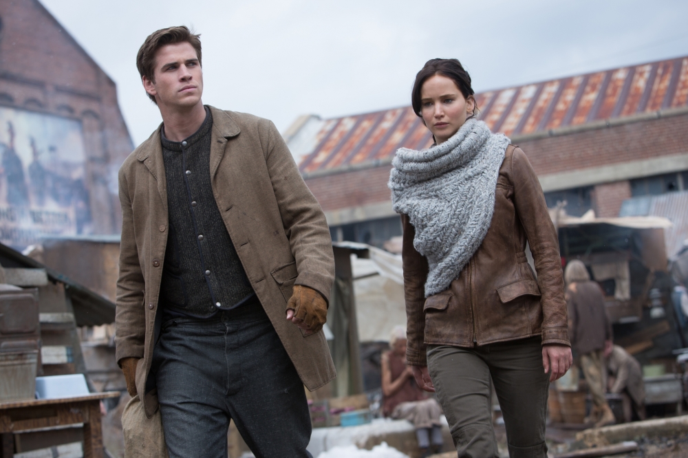 Liam Hemsworth stars as Gale Hawthorne and Jennifer Lawrence stars as Katniss Everdeen in Lionsgate Films' The Hunger Games: Catching Fire (2013)