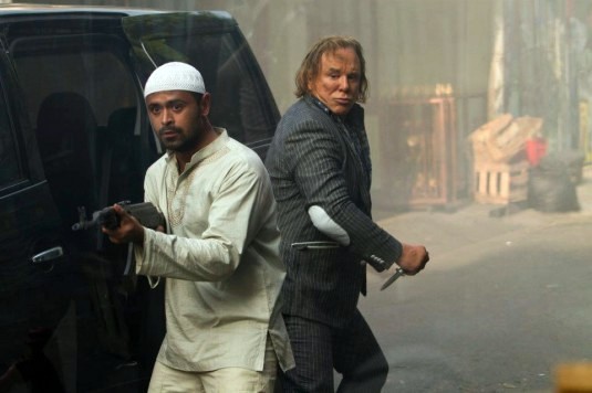Mike Muliadro stars as Achmed and Mickey Rourke stars as Malik in IFC Films' Java Heat (2013)