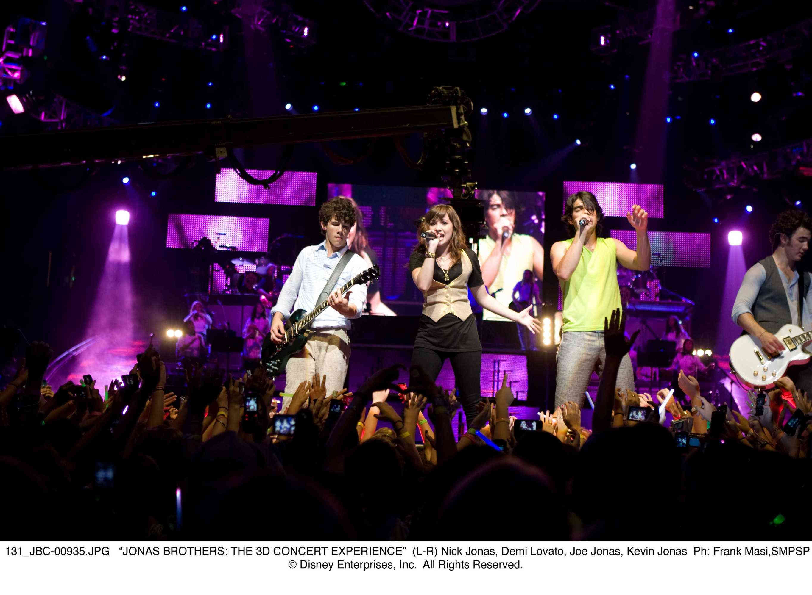 Nick Jonas, Demi Lovato, Joe Jonas and Kevin Jonas in Walt Disney Pictures' Jonas Brothers: The 3D Concert Experience (2009). Photo credit by Frank Masi.