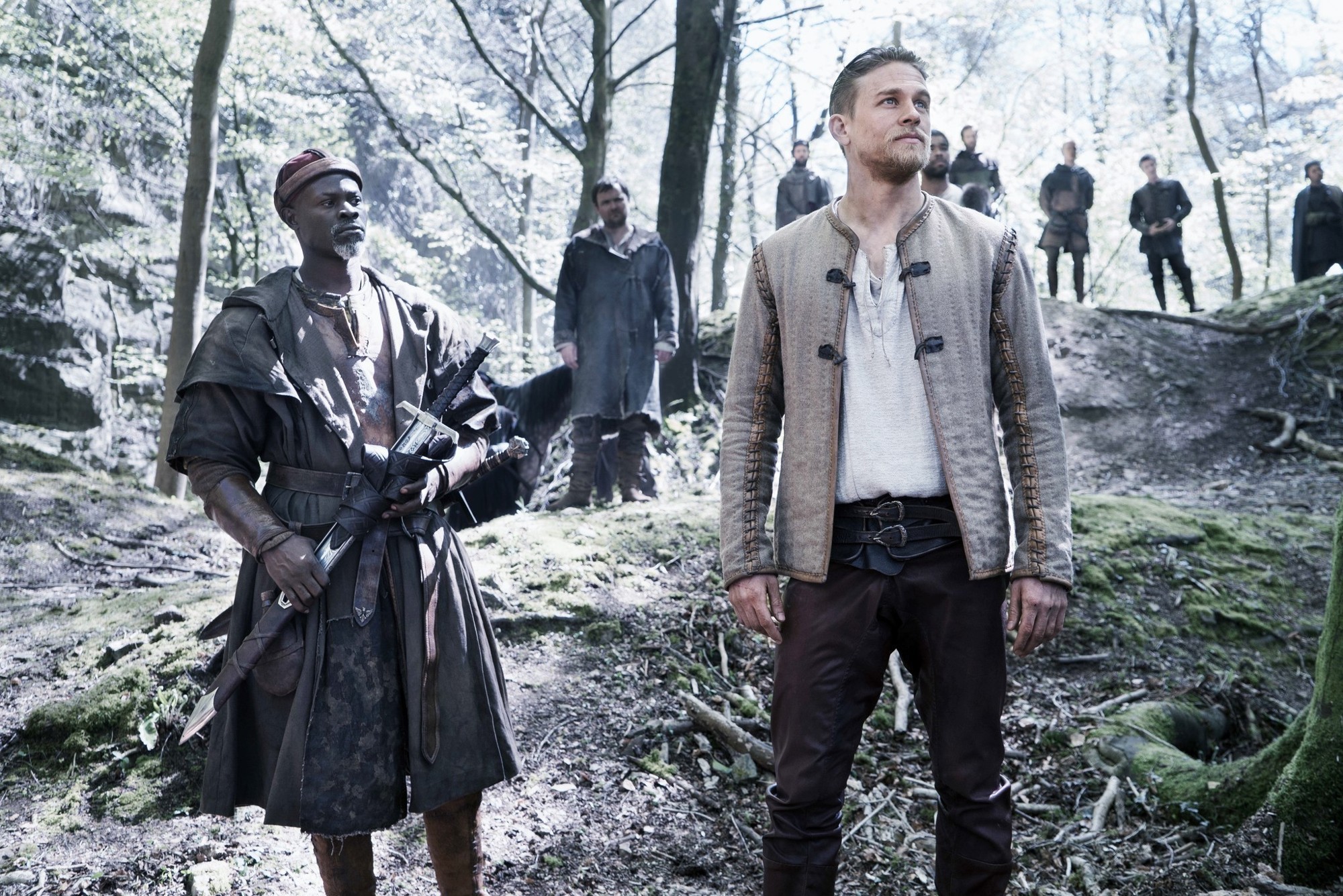 Djimon Hounsou stars as Sir Bedivere and Charlie Hunnam stars as King Arthur in Warner Bros. Pictures' King Arthur: Legend of the Sword (2017)