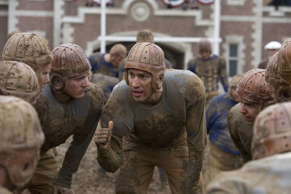War hero Carter Rutherford (JOHN KRASINSKI) huddles with his team in Universal Pictures' Leatherheads (2008).