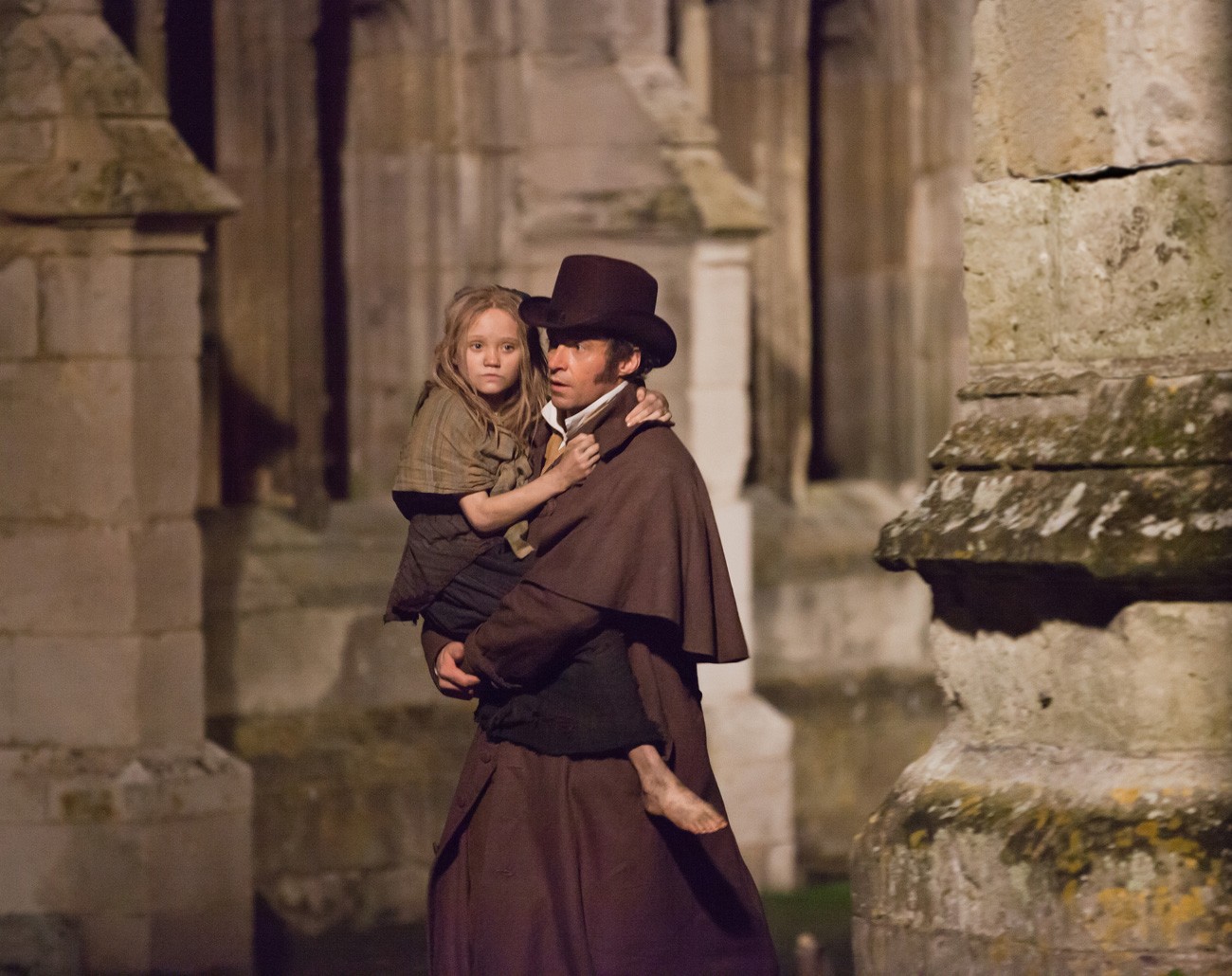 Isabelle Allen stars as Young Cosette and Hugh Jackman stars as Jean Valjean in Universal Pictures' Les Miserables (2012)