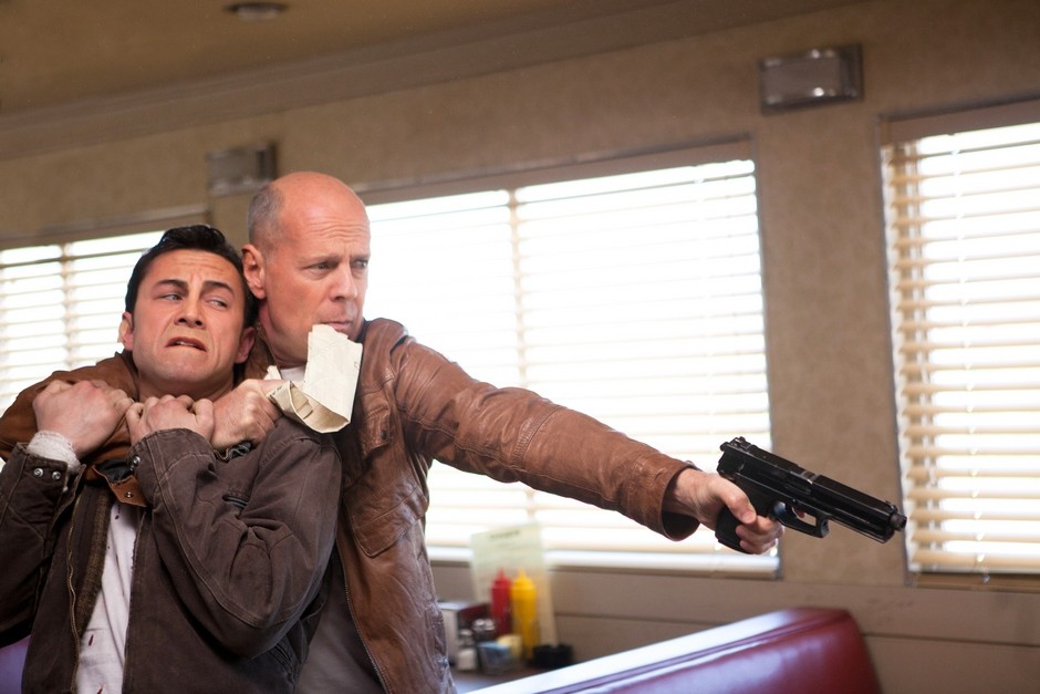 Joseph Gordon-Levitt stars as Joe and Bruce Willis stars as Older Joe in TriStar Pictures' Looper (2012)