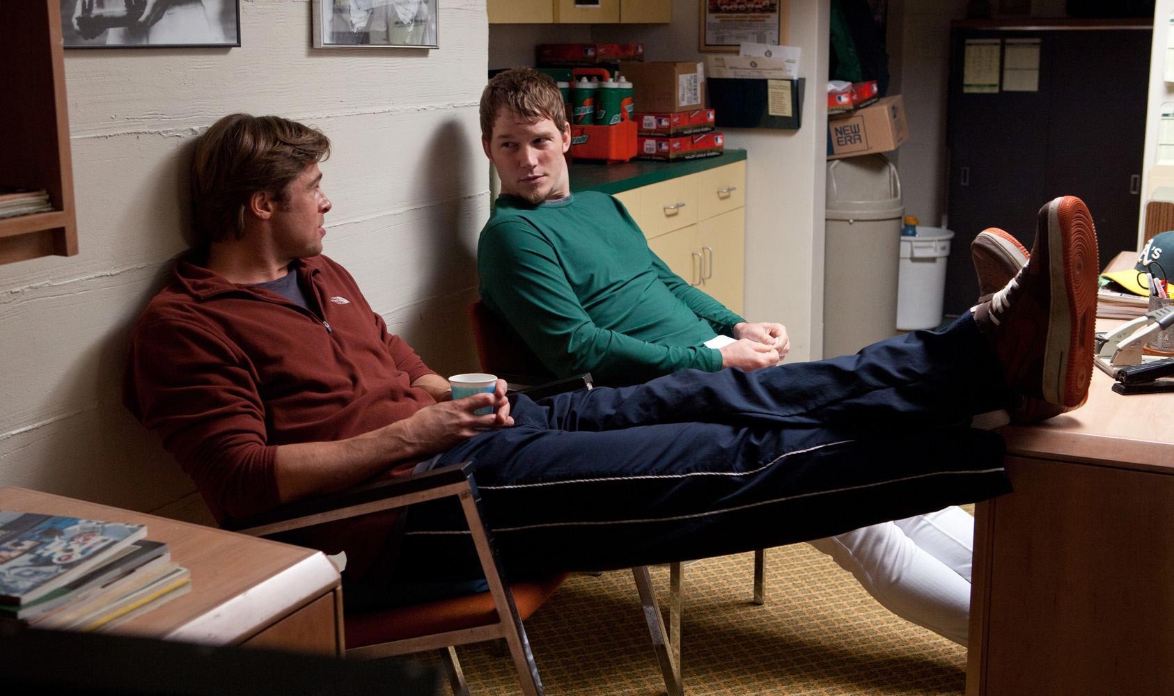 Brad Pitt stars as Billy Beane and Casey Bond stars as Chad Bradford in Columbia Pictures' Moneyball (2011)