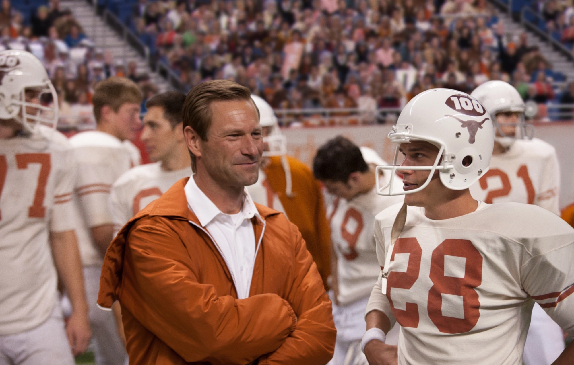 Aaron Eckhart stars as Darrell Royal and Finn Wittrock stars as Freddie Steinmark in Clarius Entertainment's My All American (2015)
