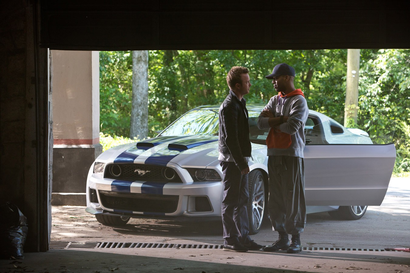 Aaron Paul (Tobey Marshall) and Kid Cudi in Walt Disney Pictures' Need for Speed (2014). Photo credit by Melinda Sue Gordon.
