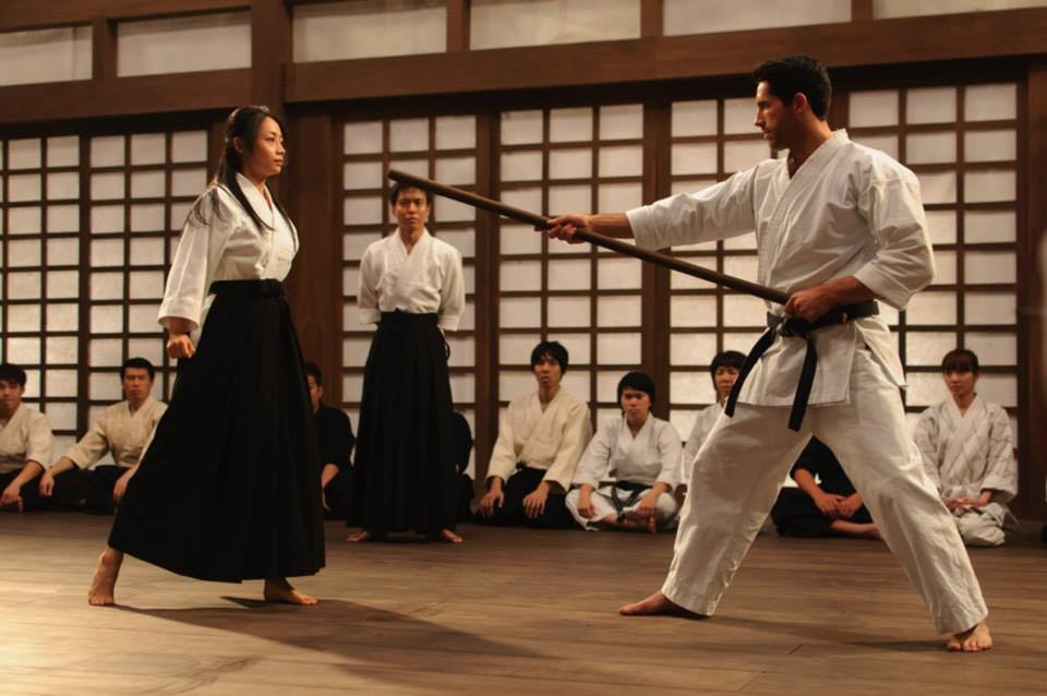 Mika Hijii stars as Namiko and Scott Adkins stars as Casey in Millennium Films' Ninja: Shadow of a Tear (2013)