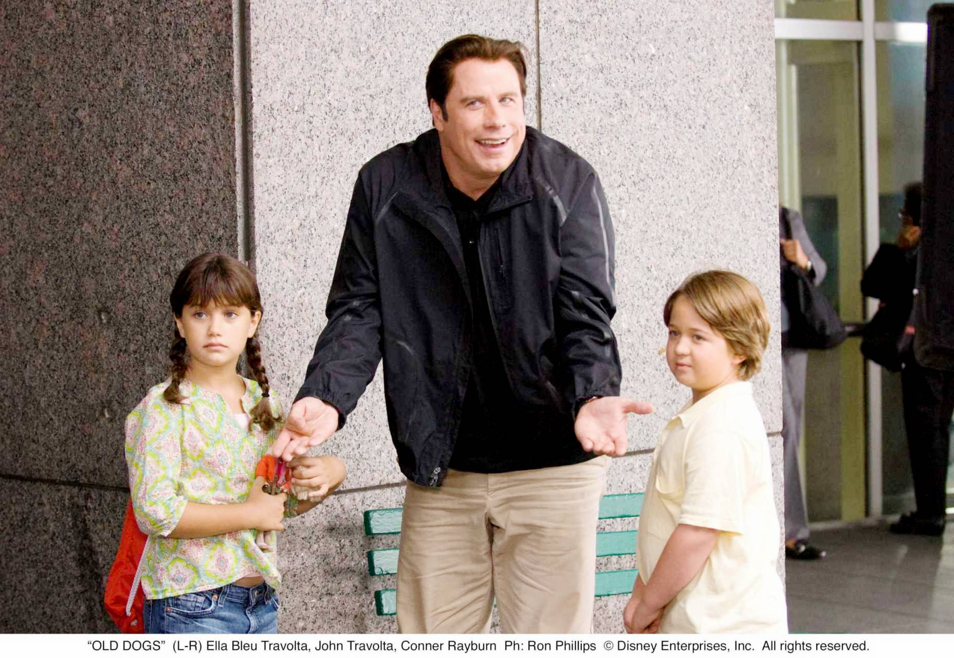 Ella Bleu Travolta, John Travolta and Conner Rayburn in Walt Disney Pictures' Old Dogs (2009). Photo credit by Ron Phillips.