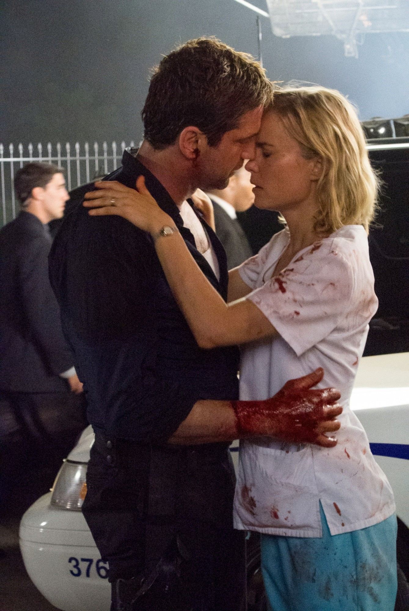 Gerard Butler stars as Mike Banning and Radha Mitchell stars as Leah in FilmDistrict's Olympus Has Fallen (2013)