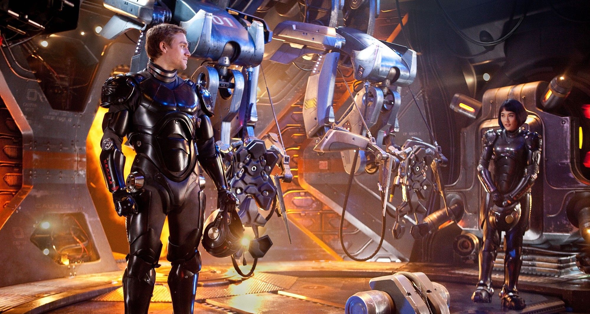 Charlie Hunnam stars as Raleigh Antrobus and Rinko Kikuchi stars as Mako Mori in Warner Bros. Pictures' Pacific Rim (2013)