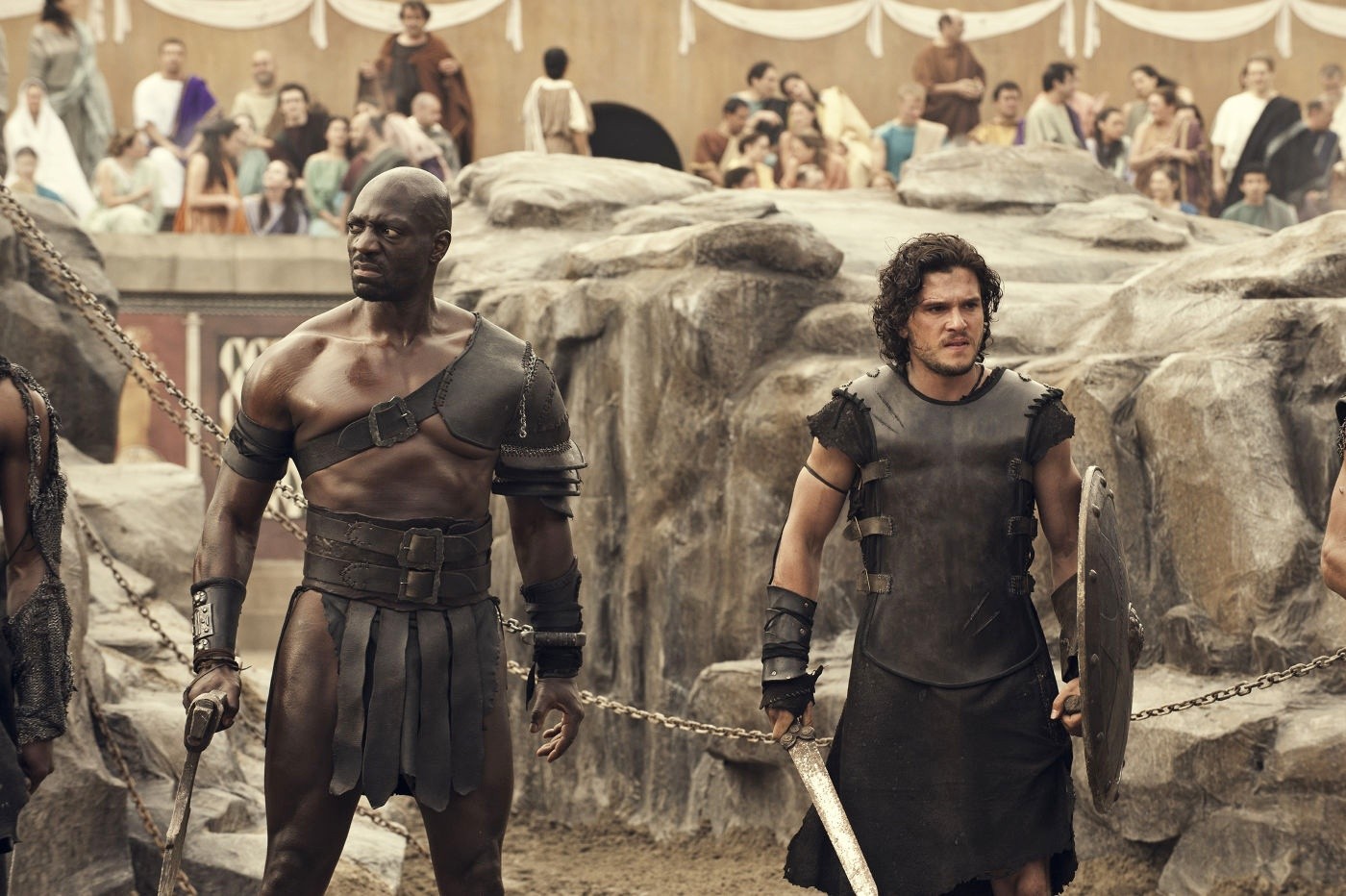 Adewale Akinnuoye-Agbaje stars as Atticus and Kit Harington stars as Milo in TriStar Pictures' Pompeii (2014)