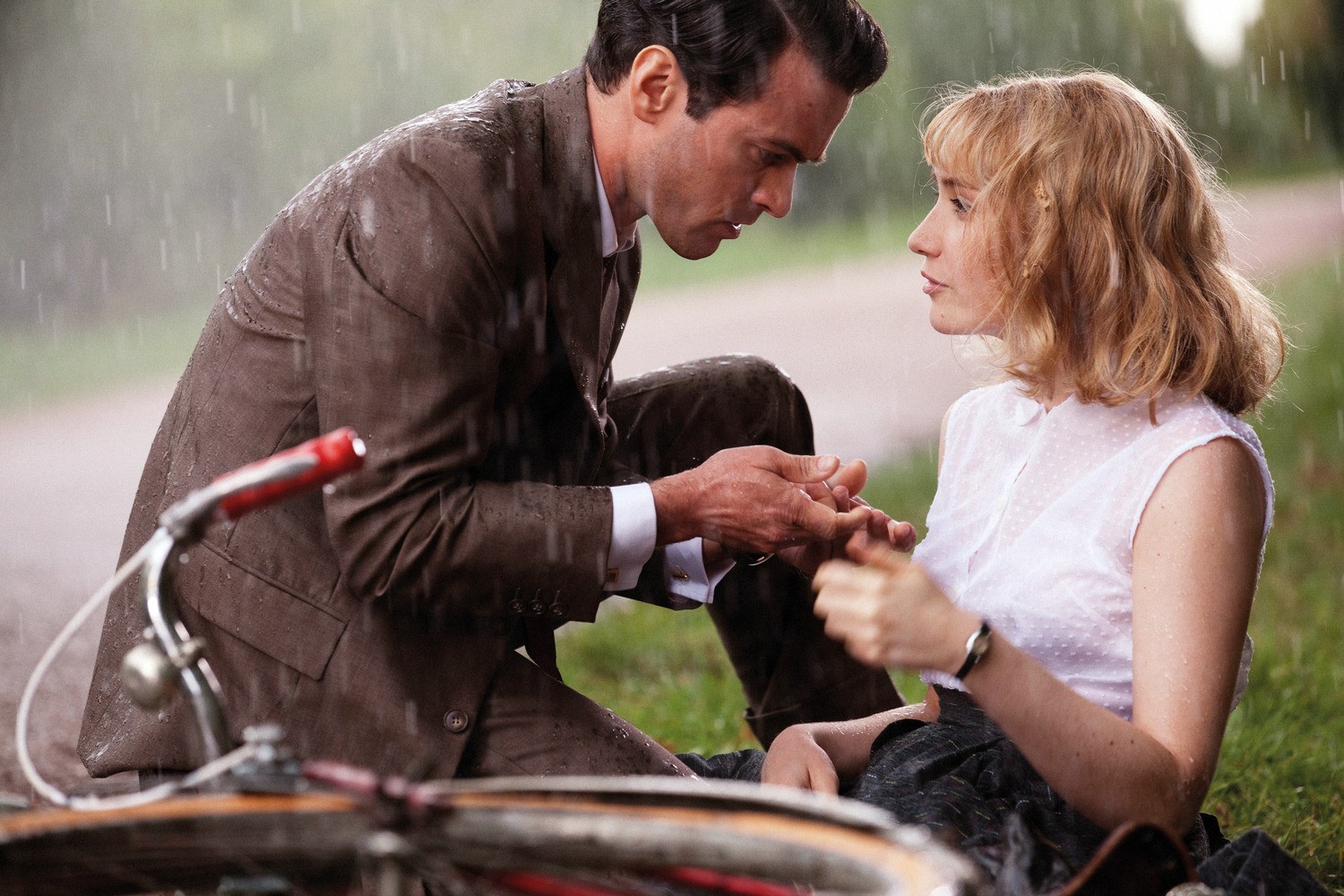 Romain Duris stars as Louis Echard and Deborah Francois stars as Rose Pamphyle in The Weinstein Company's Populaire (2013)