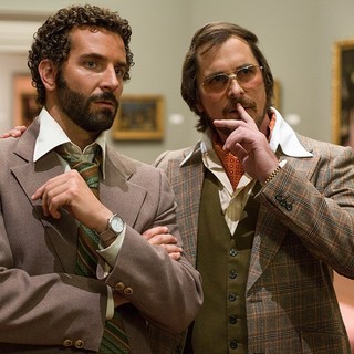 Bradley Cooper stars as Richie DiMaso and Christian Bale stars as Irving Rosenfeld in Columbia Pictures' American Hustle (2013). Photo credit by Francois Duhamel.