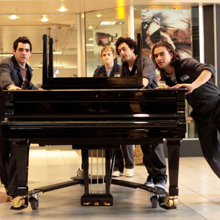 Janitors move the piano in The American Mall (2008)