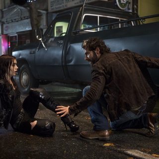 Lily Collins stars as Clary Fray and Aidan Turner stars as Luke in Screen Gems' The Mortal Instruments: City of Bones (2013). Photo credit by Rafy.