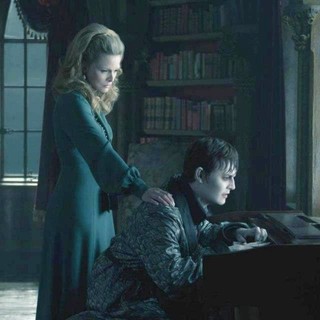 Michelle Pfeiffer stars as Elizabeth Collins Stoddard and Johnny Depp stars as Barnabas Collins in Warner Bros. Pictures' Dark Shadows (2012)