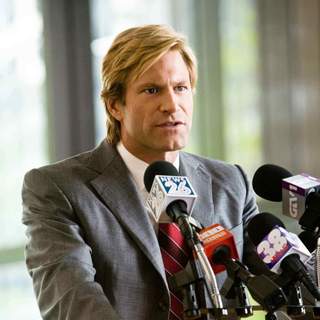 AARON ECKHART stars as Harvey Dent in Warner Bros. Pictures' and Legendary Pictures' action drama 