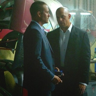 Paul Walker stars as Brian O'Conner and Vin Diesel stars as Dominic Toretto in Universal Pictures' Furious 7 (2015)