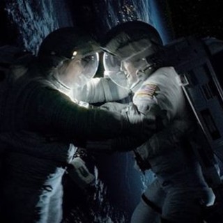 Sandra Bullock stars as Dr. Ryan Stone and George Clooney stars as Matt Kowalsky in Warner Bros. Pictures' Gravity (2013)