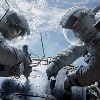 Sandra Bullock stars as Dr. Ryan Stone and George Clooney stars as Matt Kowalsky in Warner Bros. Pictures' Gravity (2013)